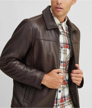 Load image into Gallery viewer, Man wearing a brown leather jacket over a plaid shirt on a light gray background